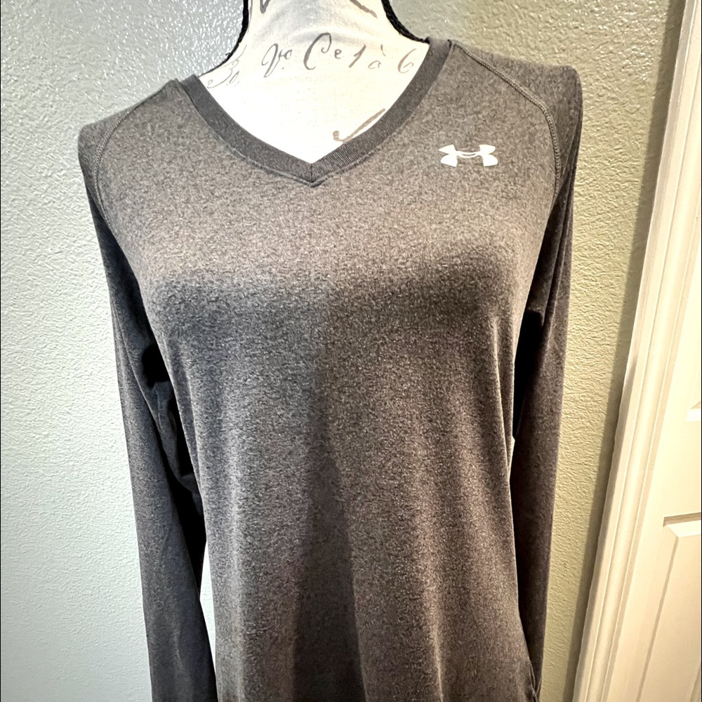Under Armour, medium size, gray color.
